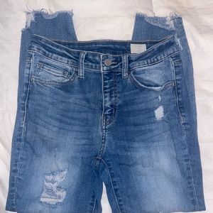 Distressed Mid-rise Skinny Jeans.